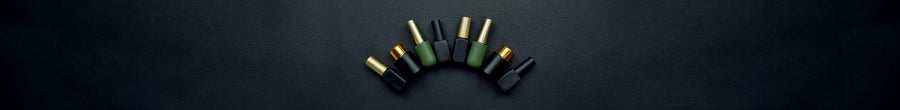 Eight gel polish bottles on a black leather surface